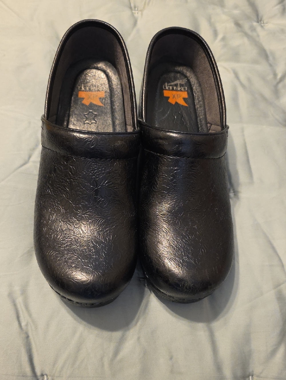 Dansko Black Floral-Textured Leather Clogs